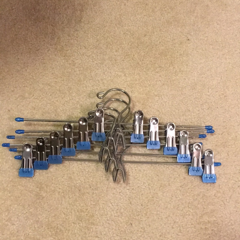 6 Brand New Hangers with clasps and a hook